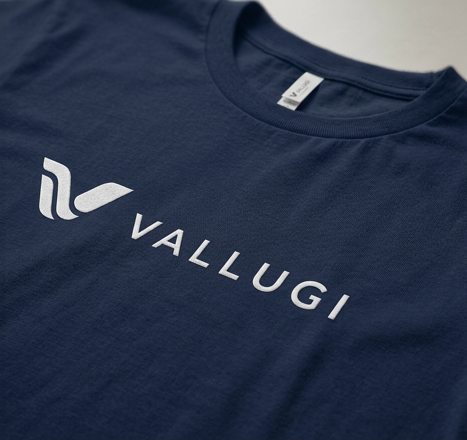 Navy blue t-shirt with 'Vallugi' logo on a light gray background